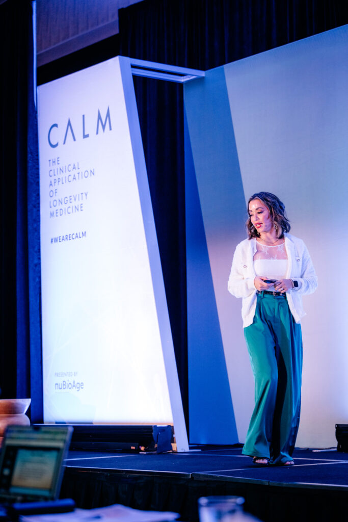 Lexi Yoo NP delivering a talk at the CALM longevity medicine conference