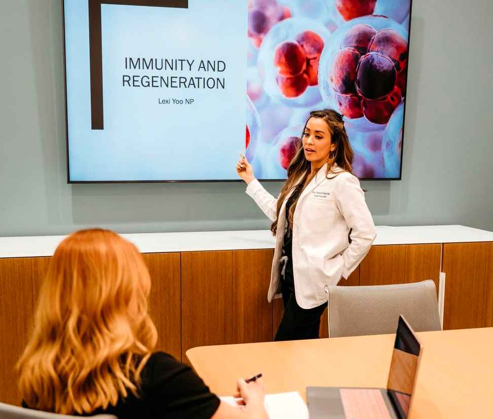 Lexi Yoo NP teaching about immunity and regeneration during a clinical education session