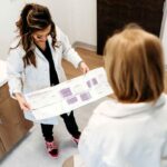 Lexi Yoo NP reviewing a hormone optimization chart with a patient in her clinic